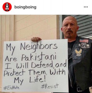 Photo of Veteran holding a sign stating support for Pakistani neighbor